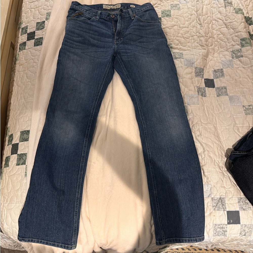Men’s bootcut Ariat jeans.